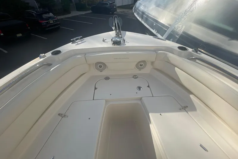 Slide: The Image of 2018 Grady-White Freedom 235 boat interior with seating and storage compartments. - 72