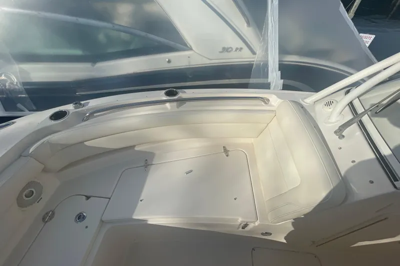 Slide: The Image of 2018 Grady-White Freedom 235 boat interior with seating and storage compartments. - 73