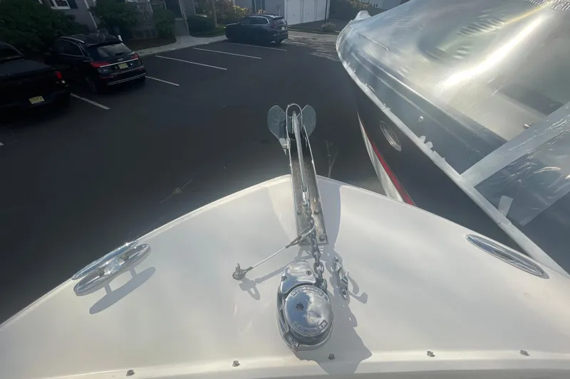 Slide: The Image of 2018 Grady-White Freedom 235 boat bow with anchor in a parking lot. - 76