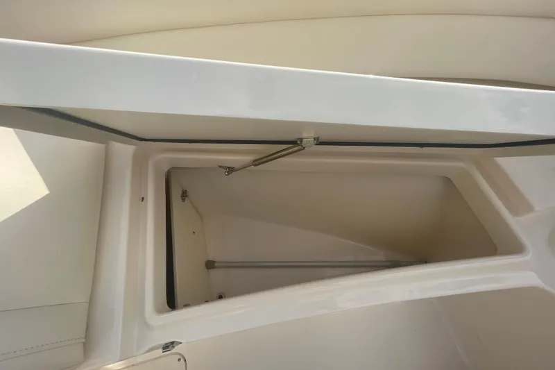 Slide: The Image of Open storage compartment on a 2018 Grady-White Freedom 235 boat. - 78