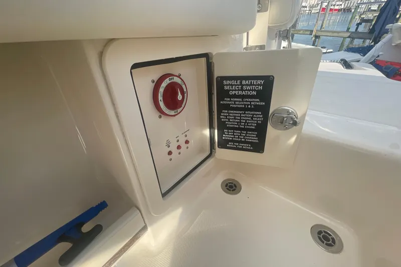 Slide: The Image of 2018 Grady-White Freedom 235 boat battery switch panel with operation instructions. - 90
