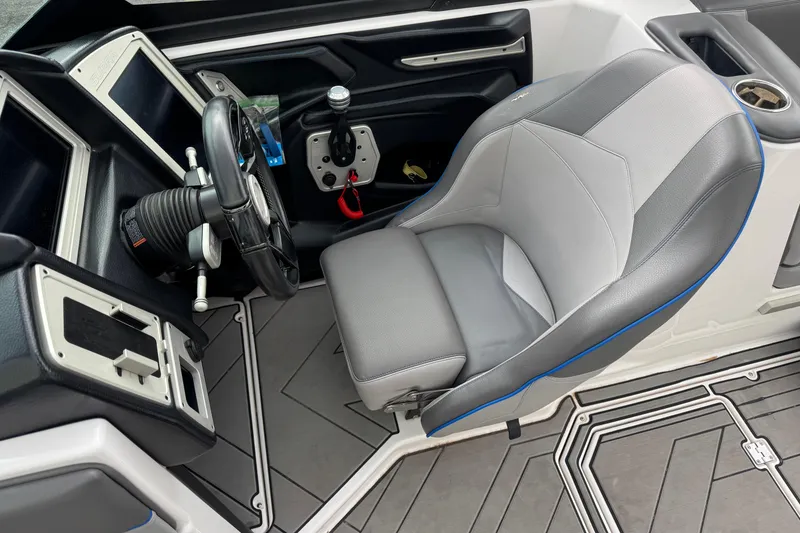 Slide: The Image of 2020 Supra SL 575 boat interior with steering wheel and captain's seat. - 7