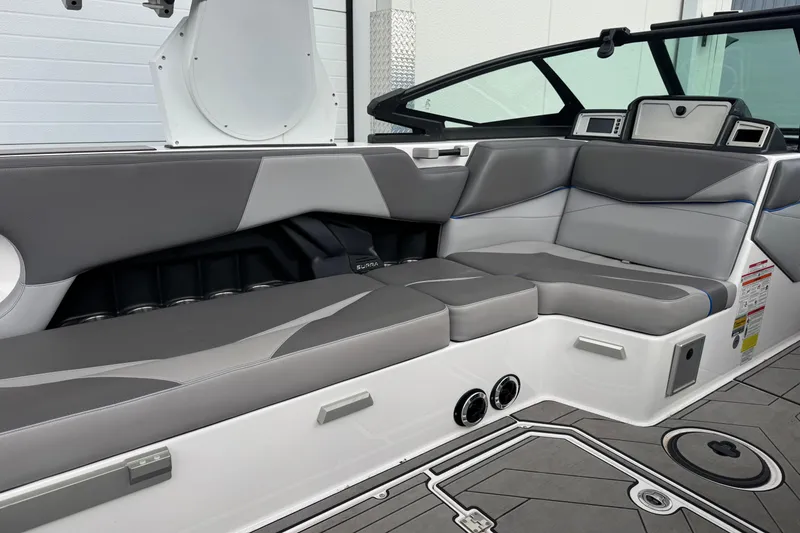 Slide: The Image of 2020 Supra SL 575 boat interior with sleek gray seating and modern design. - 8