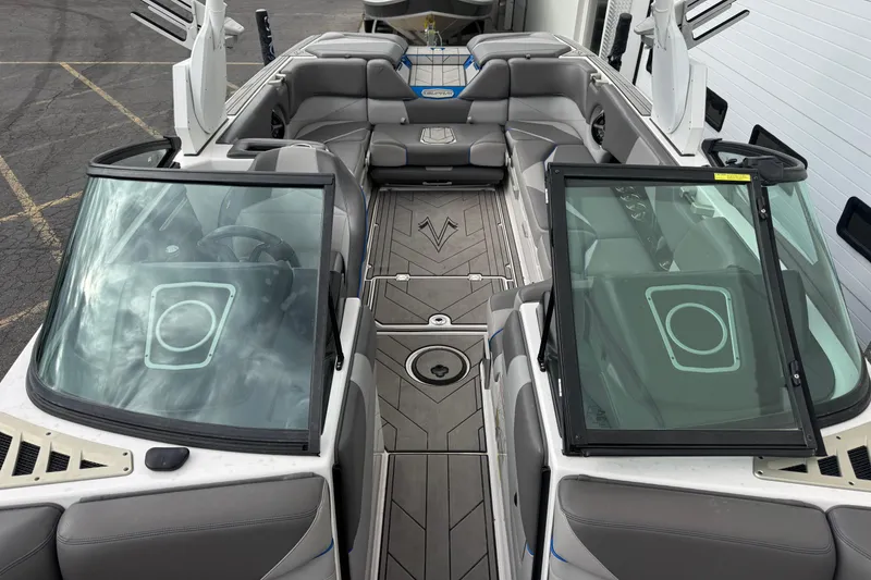 Slide: The Image of 2020 Supra SL 575 boat interior with gray seating and sleek design. - 9