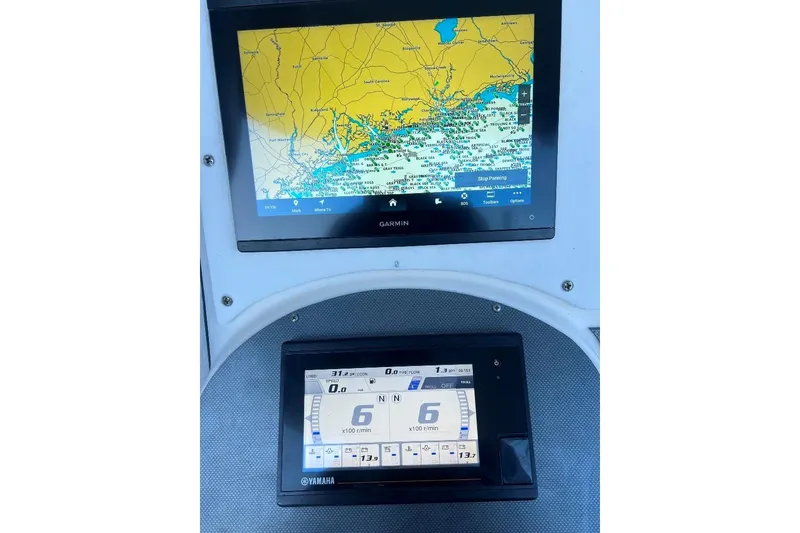 Slide: The Image of 2008 McKee Craft Freedom 28 FS/CC dashboard with Garmin and Yamaha displays. - 10
