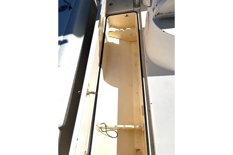 Slide: The Image of 2008 McKee Craft Freedom 28 FS/CC boat storage compartment, open and empty. - 11