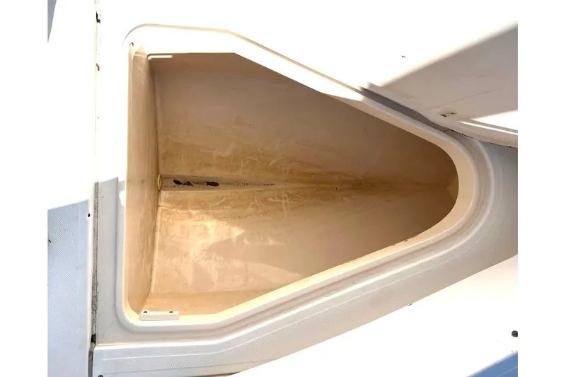 Slide: The Image of Storage compartment of 2008 McKee Craft Freedom 28 FS/CC boat, open and empty. - 15
