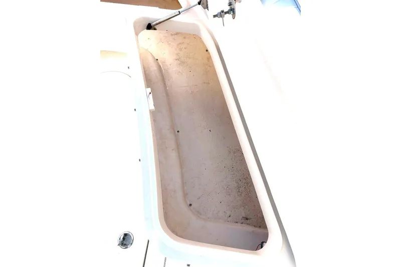 Slide: The Image of 2008 McKee Craft Freedom 28 FS/CC boat storage compartment, open and empty. - 17