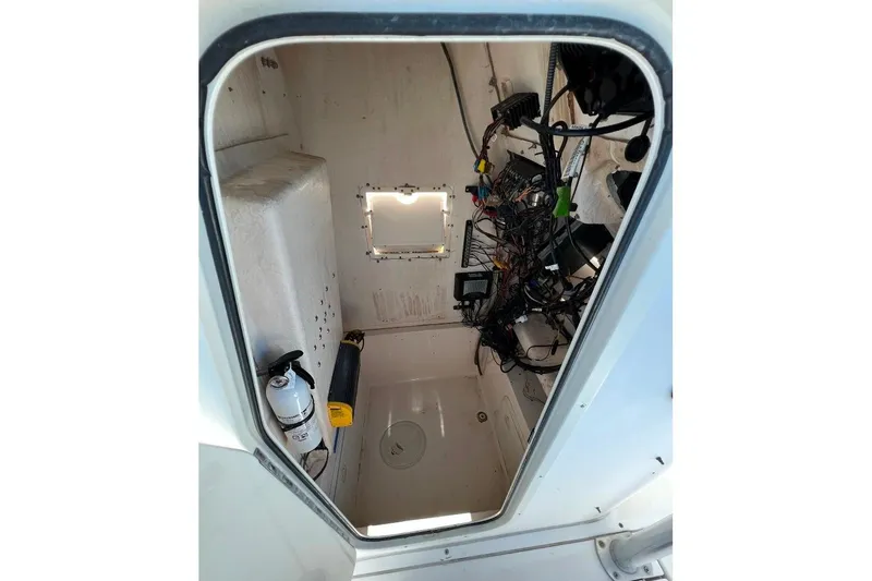 Slide: The Image of 2008 McKee Craft Freedom 28 FS/CC interior with wiring and equipment. - 24