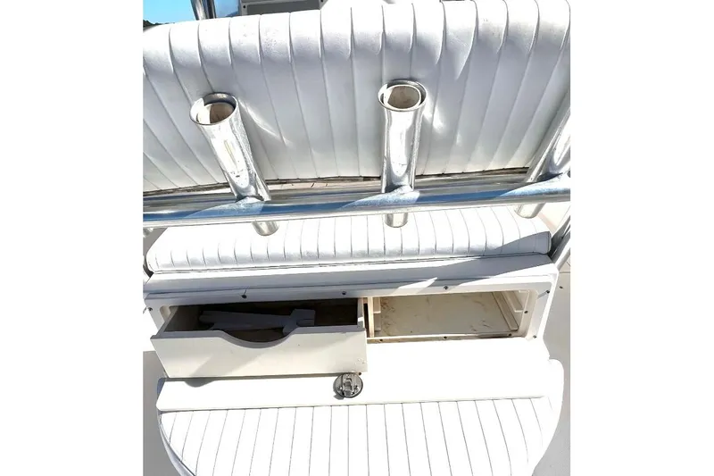 Slide: The Image of 2008 McKee Craft Freedom 28 FS/CC boat seating with rod holders and storage compartment. - 25