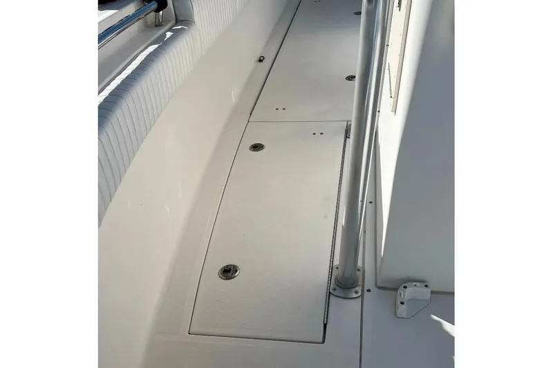 Slide: The Image of 2008 McKee Craft Freedom 28 FS/CC boat deck with storage compartments. - 26