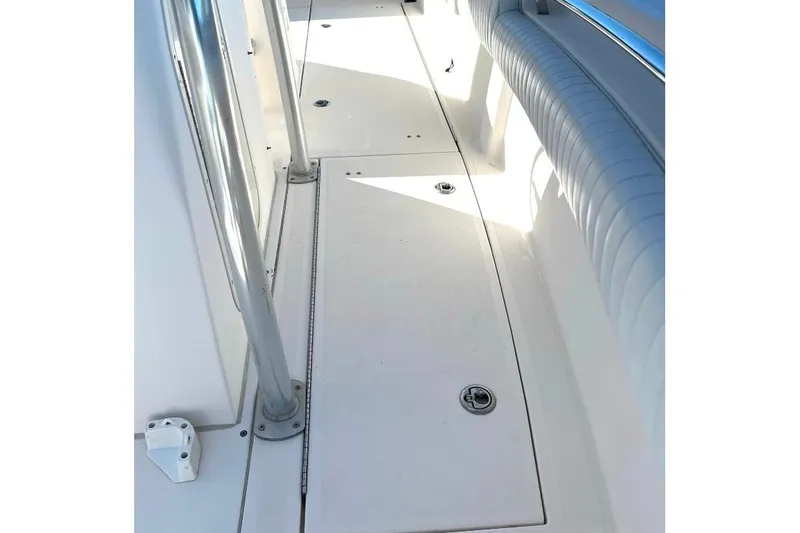 Slide: The Image of 2008 McKee Craft Freedom 28 FS/CC boat deck with seating and storage compartments. - 27