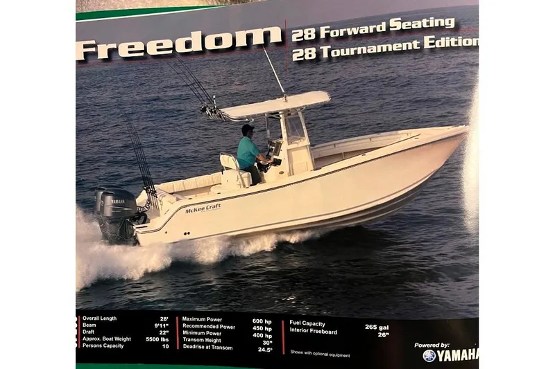 Slide: The Image of 2008 McKee Craft Freedom 28 FS/CC boat on water, featuring Yamaha engines. - 31