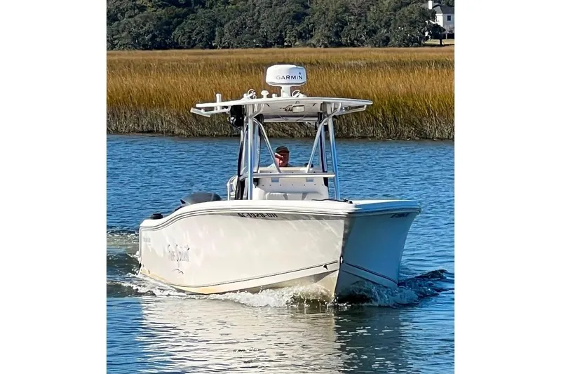Slide: The Image of 2008 McKee Craft Freedom 28 FS/CC boat cruising on a calm waterway. - 4