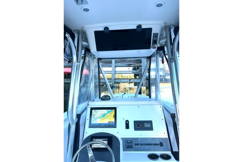 Slide: The Image of 2008 McKee Craft Freedom 28 FS/CC boat dashboard with navigation system and controls. - 9