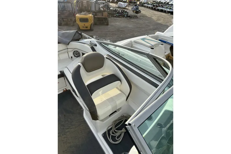 Slide: The Image of 2016 Yamaha Boats 212SS interior with seating and steering area, showcasing sleek design. - 18