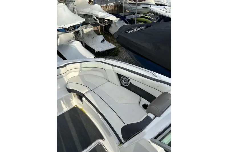 Slide: The Image of 2016 Yamaha Boats 212SS interior with white seating and speaker detail. - 23
