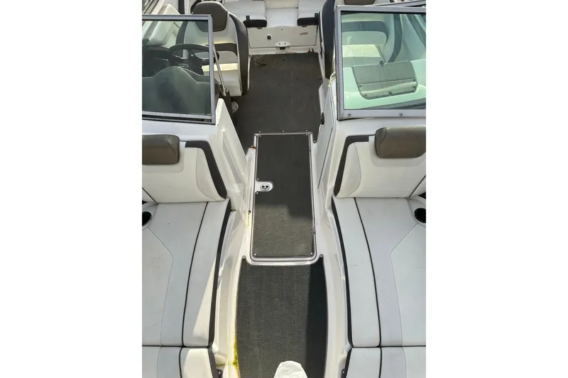 Slide: The Image of 2016 Yamaha Boats 212SS interior view, featuring seating and cockpit area. - 27