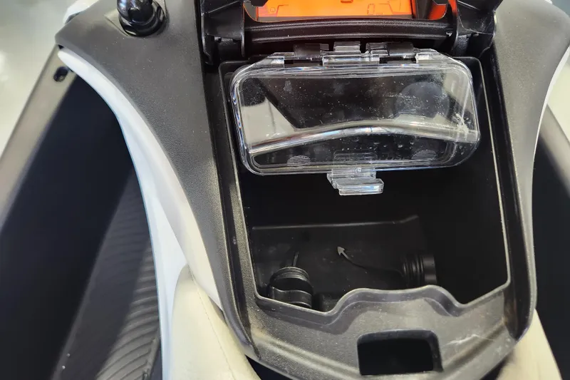 Slide: The Image of 2024 Seadoo SPARK TRIXX 1 UP handlebars in showroom, showcasing sleek design and controls. - 11