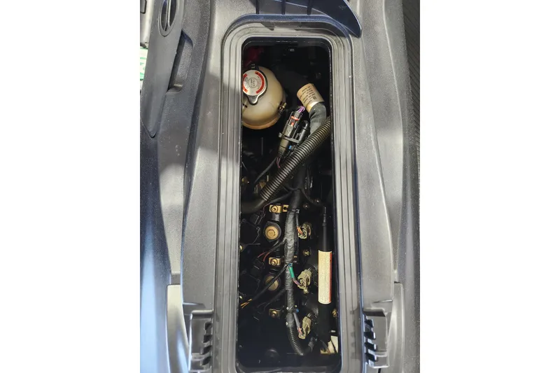 Slide: The Image of 2024 Seadoo SPARK TRIXX 1 UP storage compartment with clear cover and dashboard view. - 13