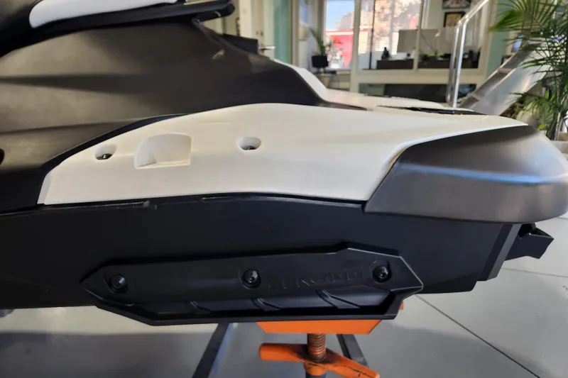 Slide: The Image of 2024 Sea-Doo Spark Trixx jet ski on trailer in showroom setting. - 6