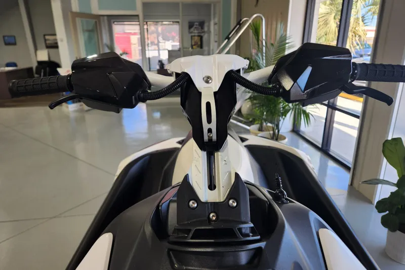 Slide: The Image of 2024 Sea-Doo Spark Trixx on trailer, showcasing wheel and hull details. - 9