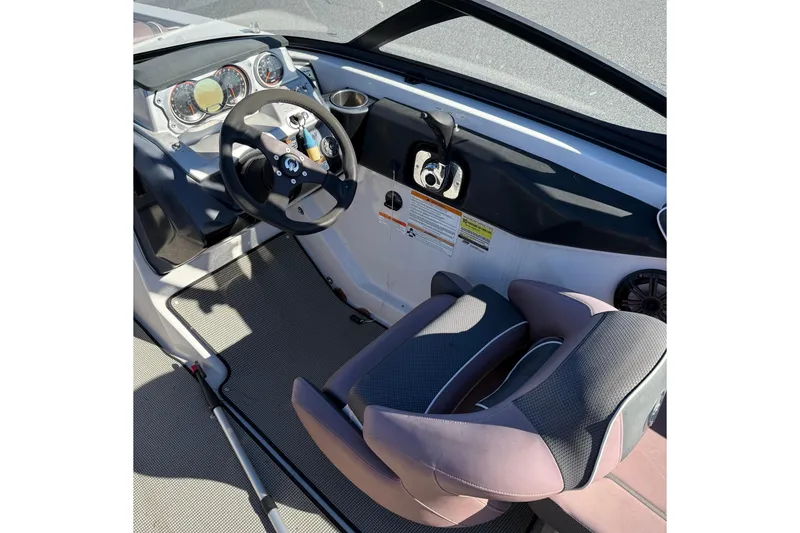 Slide: The Image of 2017 Scarab 215 HO Impulse boat cockpit with steering wheel and seat. - 11