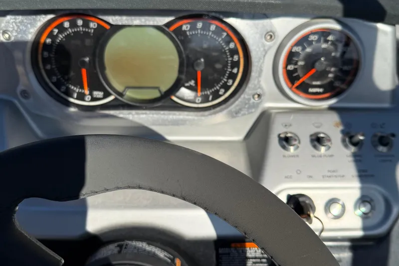 Slide: The Image of Dashboard of a 2017 Scarab 215 HO Impulse boat with gauges and controls. - 12