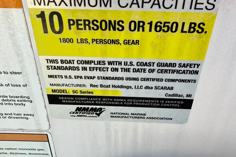 Slide: The Image of 2017 Scarab 215 HO Impulse capacity label, max 10 persons or 1650 lbs, NMMA certified. - 13