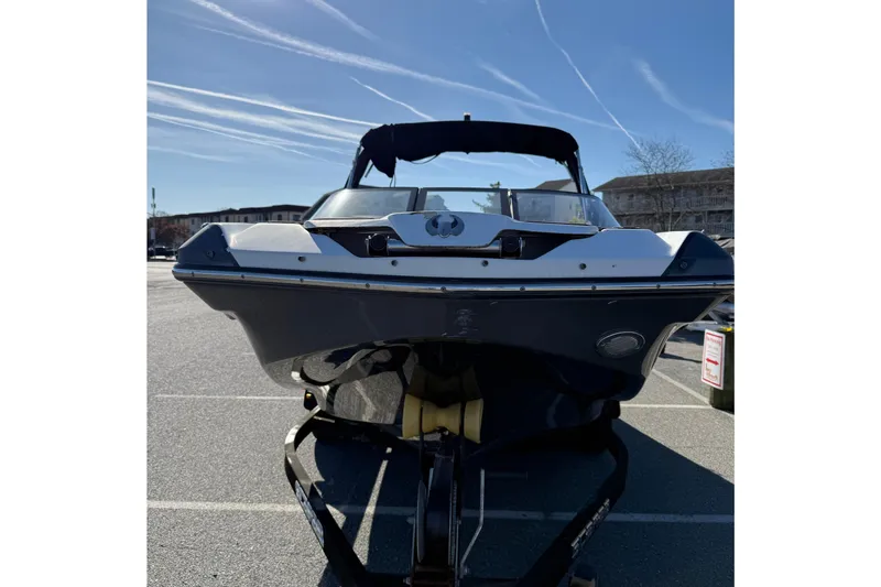 Slide: The Image of 2017 Scarab 215 HO Impulse boat on trailer in parking lot. - 3