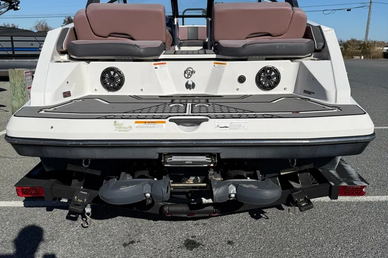 Slide: The Image of 2017 Scarab 215 HO Impulse boat rear view with speakers and seating. - 7