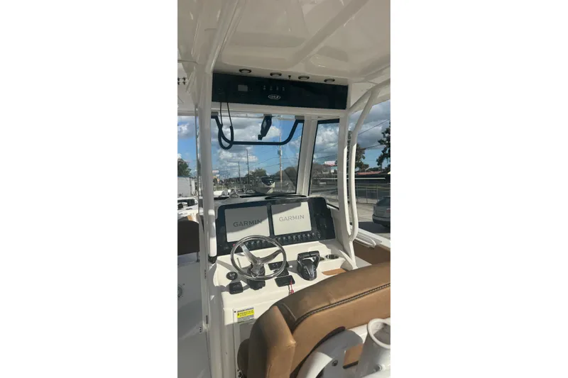 Slide: The Image of 2022 Sea Hunt Gamefish 25 boat cockpit with Garmin navigation system. - 14