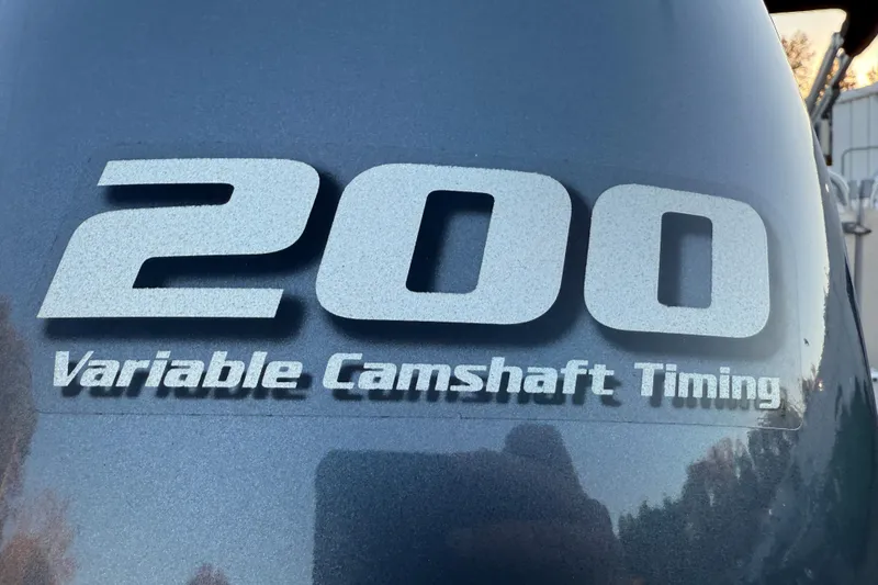 Slide: The Image of Close-up of 2011 Tahoe Pontoon 2485 DRL engine with '200 Variable Camshaft Timing' label. - 12