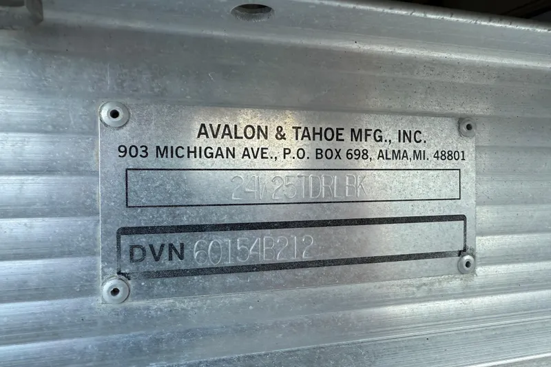 Slide: The Image of Metal plate on a 2011 Tahoe Pontoon 2485 DRL, showing manufacturer details. - 7