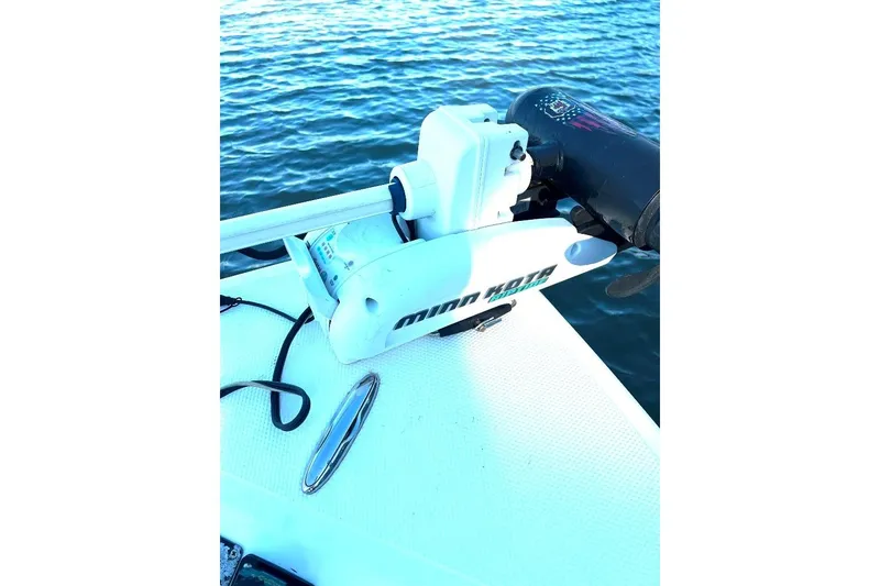 Slide: The Image of Trolling motor on a 2015 BlackJack 224 boat, floating on calm water. - 11