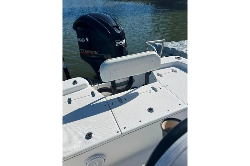 Slide: The Image of 2015 BlackJack 224 boat with Yamaha VMAX 250 engine on calm water. - 23
