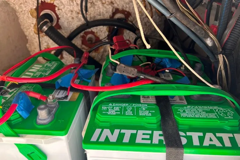 Slide: The Image of Two Interstate batteries with red cables in a BlackJack 224, 2015 model. - 8