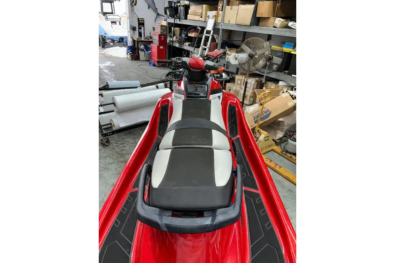 Slide: The Image of 2018 Yamaha WaveRunner GP1800 in a workshop, red and black design. - 7