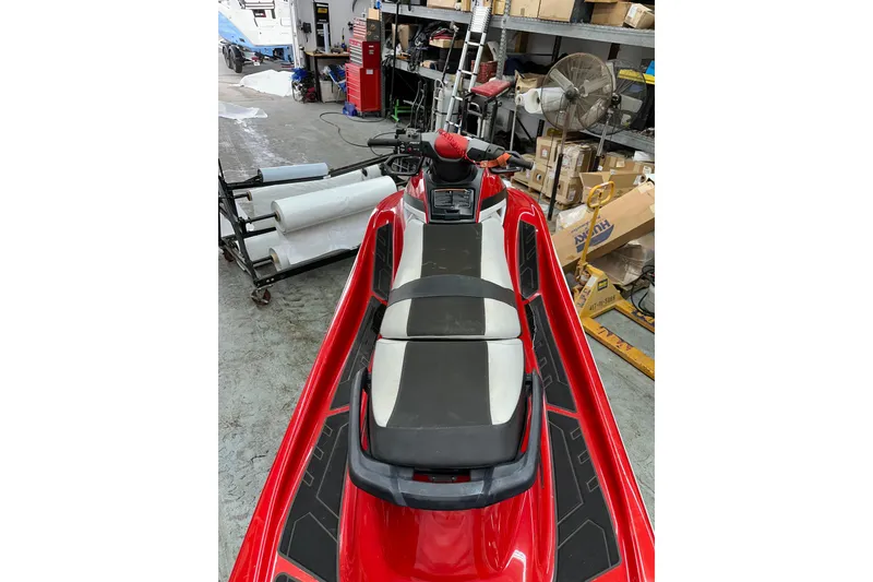 Slide: The Image of 2018 Yamaha WaveRunner GP1800 in a workshop, red and black design. - 9