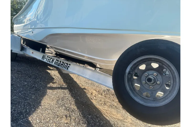 Slide: The Image of 2026 Action Craft 22 Bay boat on Hi-Tech Marine trailer, side view. - 11