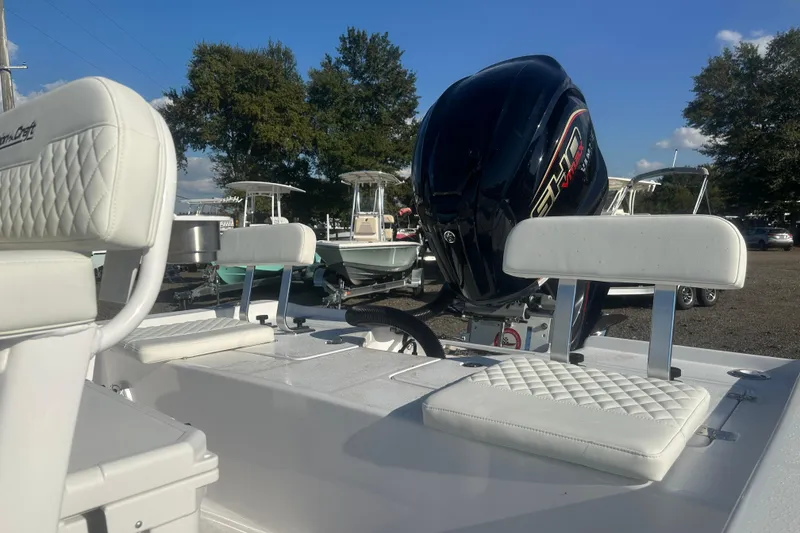 Slide: The Image of 2026 Action Craft 22 Bay boat with white seating and powerful outboard motor. - 16