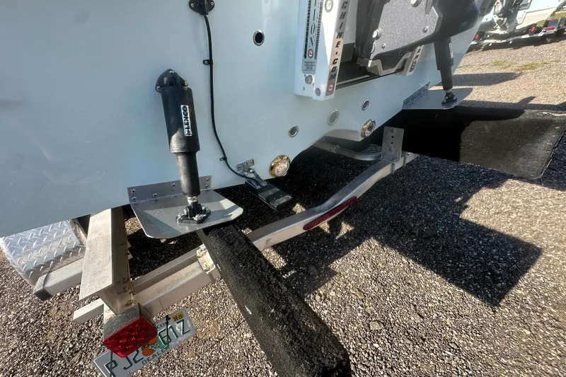 Slide: The Image of 2026 Action Craft 22 Bay boat on trailer, showing rear details and license plate. - 25