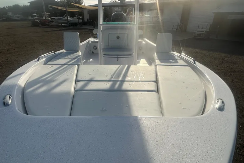 Slide: The Image of 2026 Action Craft 22 Bay boat with sleek white deck in sunlight. - 26