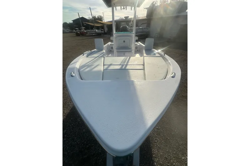 Slide: The Image of 2026 Action Craft 22 Bay boat, front view, in a sunny outdoor setting. - 27