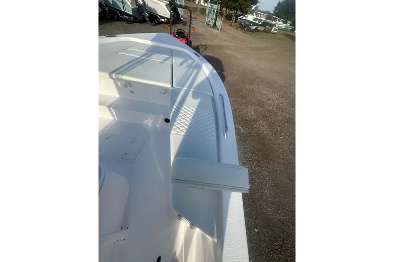 Slide: The Image of 2026 Action Craft 22 Bay boat interior with white seating and storage compartments. - 29