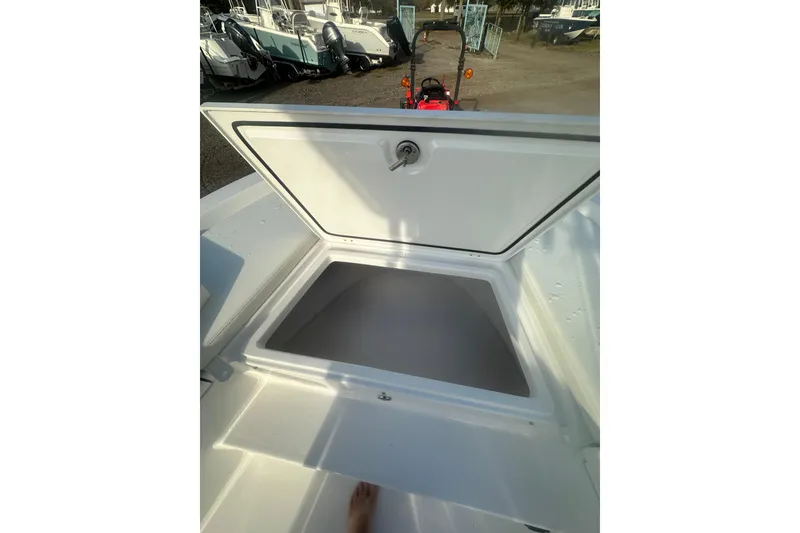 Slide: The Image of Open storage compartment on 2026 Action Craft 22 Bay boat, showcasing spacious interior. - 37