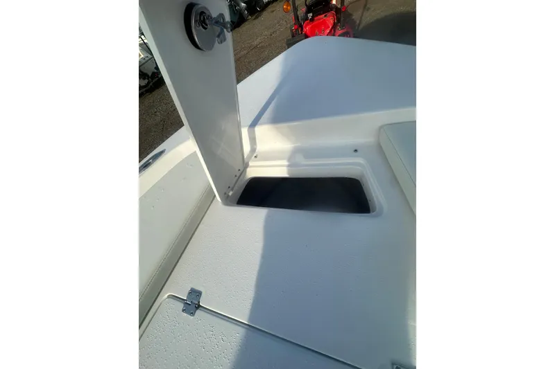 Slide: The Image of 2026 Action Craft 22 Bay boat storage compartment with open hatch. - 38