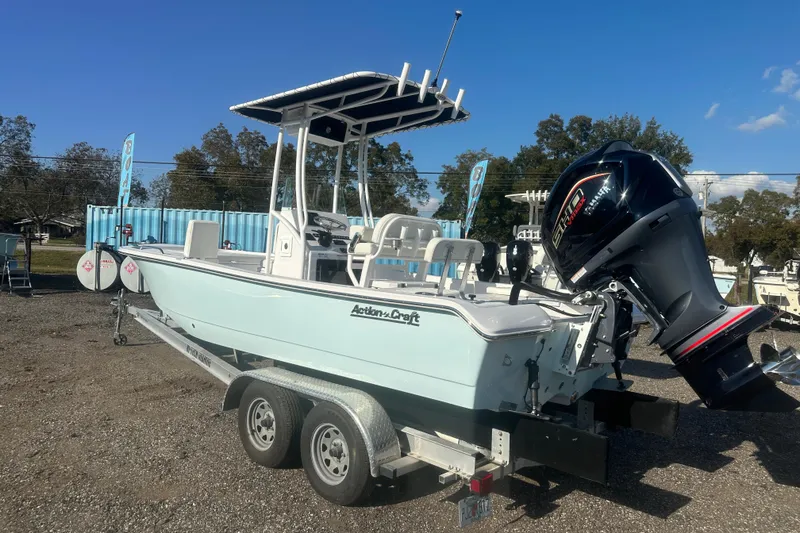 Slide: The Image of 2026 Action Craft 22 Bay boat on trailer with powerful outboard motor. - 4