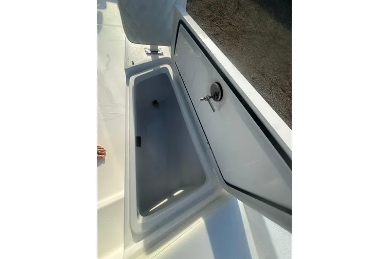 Slide: The Image of Open storage compartment on 2026 Action Craft 22 Bay boat, showcasing interior space. - 41