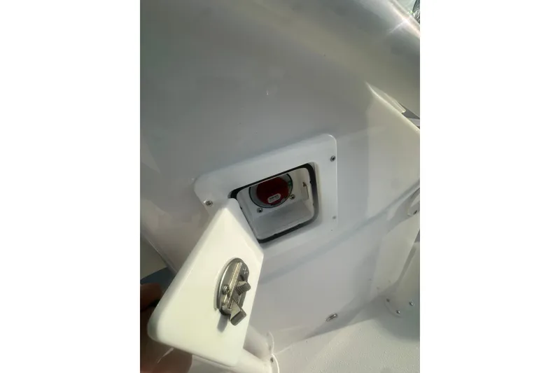 Slide: The Image of 2026 Action Craft 22 Bay boat compartment with open latch, showcasing interior details. - 43